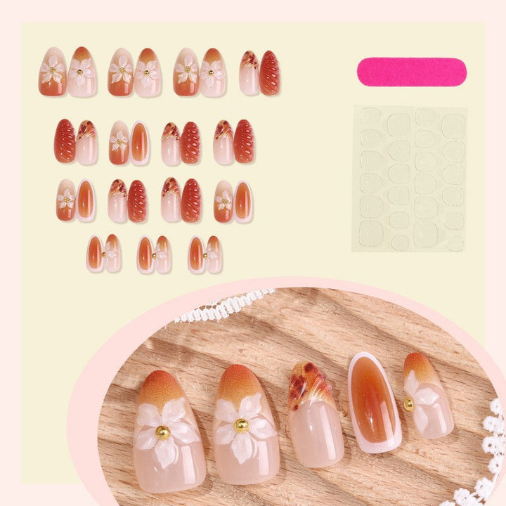 Artificial nail set with handcrafted flowers and elegant embellishments Stornfield