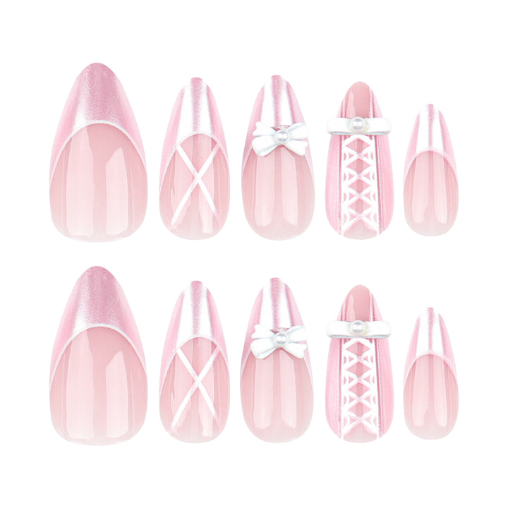 Artistic stiletto nails with elegant pearl and bow accents Stornfield