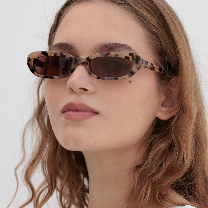 Women's trendy cat-eye sunglasses with transparent plastic frame and UV protection Stornfield