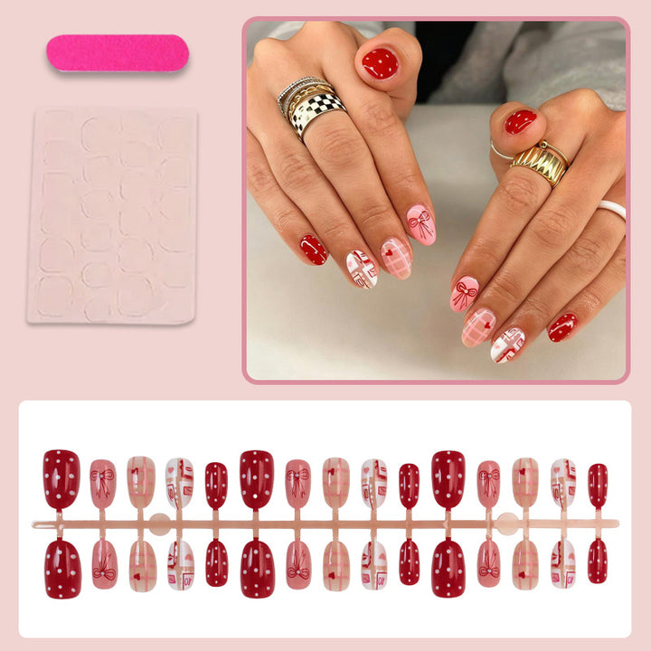 Artificial nail set with charming heart and bow patterns Stornfield