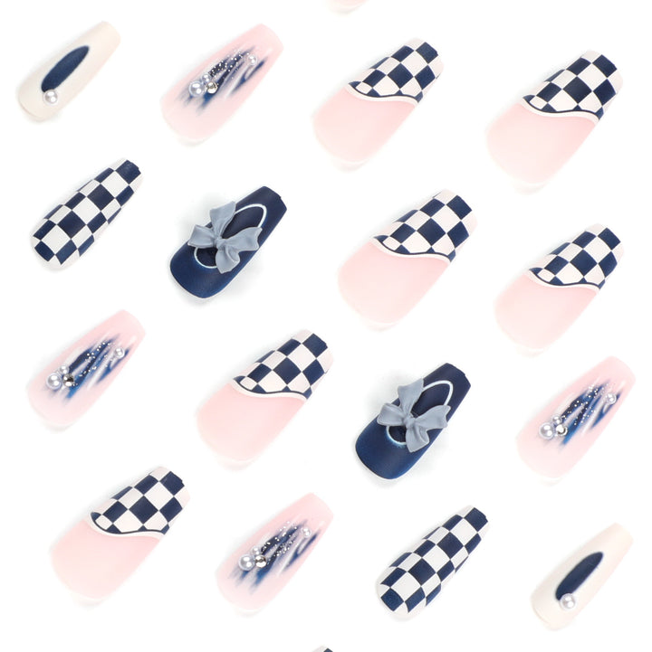 Artful nail decoration with bows and plaid pattern Stornfield