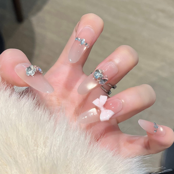 Elegant Nail Art Extensions with Pearl Accents Stornfield