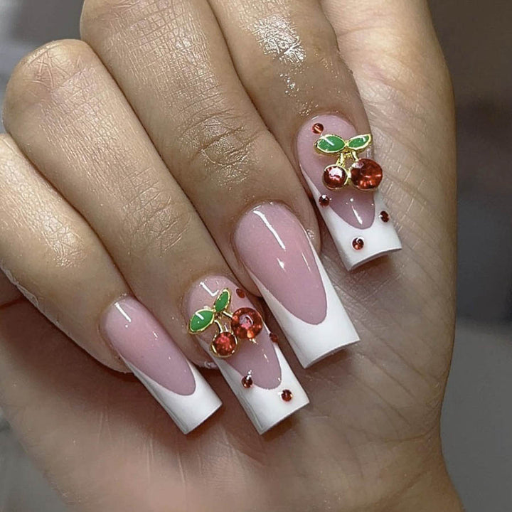 Acrylic nail set with chic cherry motifs and elegant French tip Stornfield