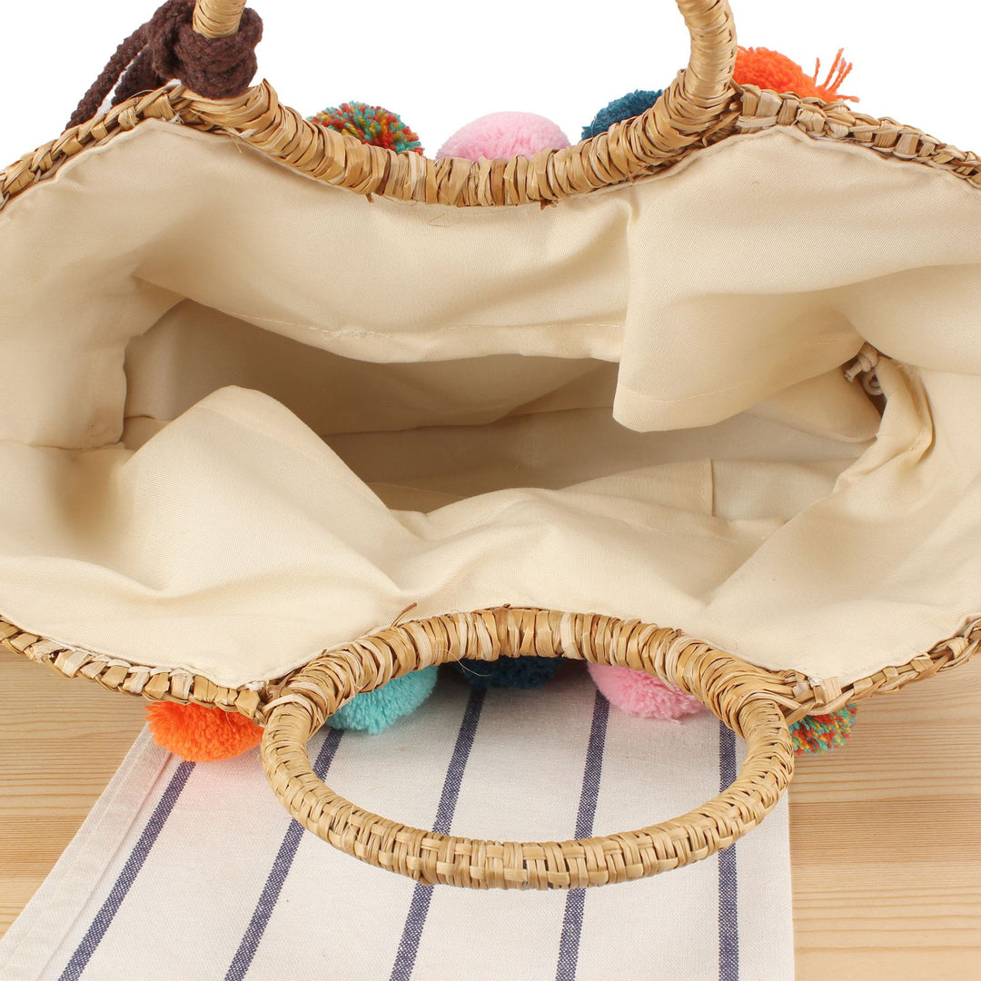 Straw handbag with colorful tassels and pom poms Stornfield