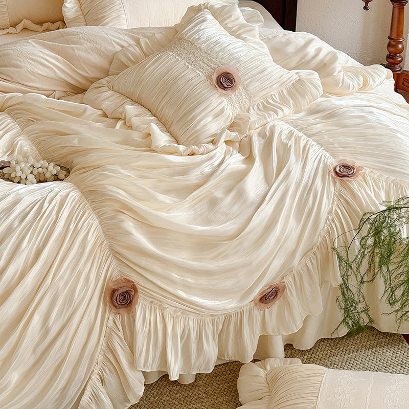 Romantic bedspread set with gathered satin look, frill, and rose appliqués
