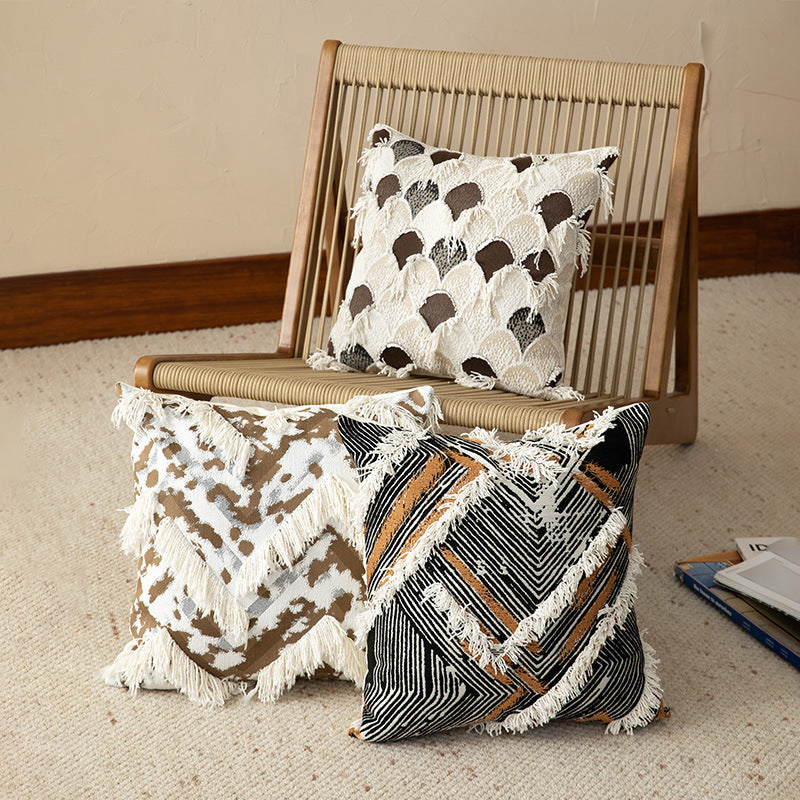 Woven square decorative cushion with fringe application and geometric pattern