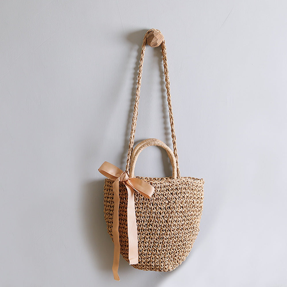 Basket bag with stylish carrying handles and decorative bow Stornfield