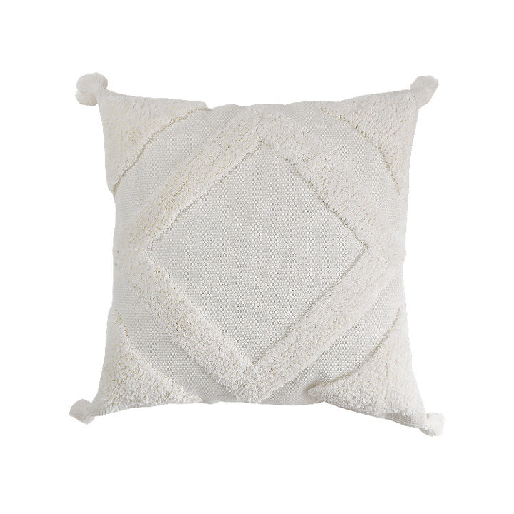 Square decorative cushion cover made of cotton bouclé with raised diamond pattern and corner tassels