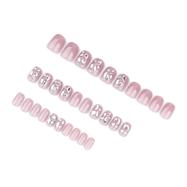 Artificial nail art with glamorous glitter accents Stornfield