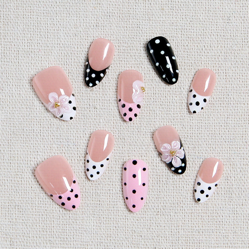 Nail art set with floral accents and elegant dots Stornfield