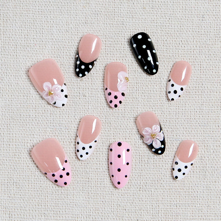 Nail art set with floral accents and elegant dots Stornfield