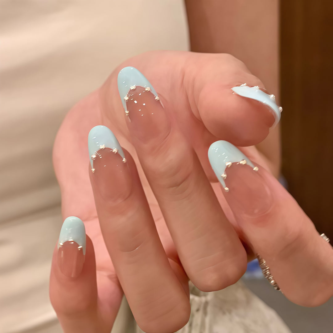 Artistic French Tip Nail Design with Glitter Accents Stornfield