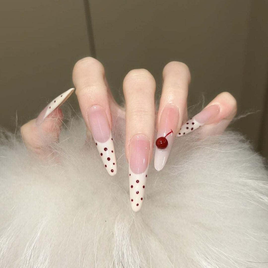 Artificial nails with playful design and cherry accents Stornfield