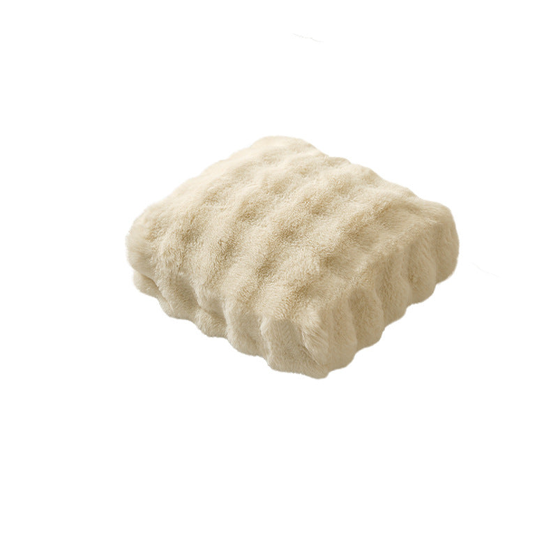 Plush floor cushion pouf with padded filling and faux fur cover