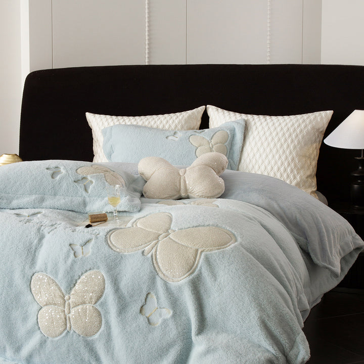 Cozy bedding and throw blanket set with applied butterfly appliqués and velvety microfleece look