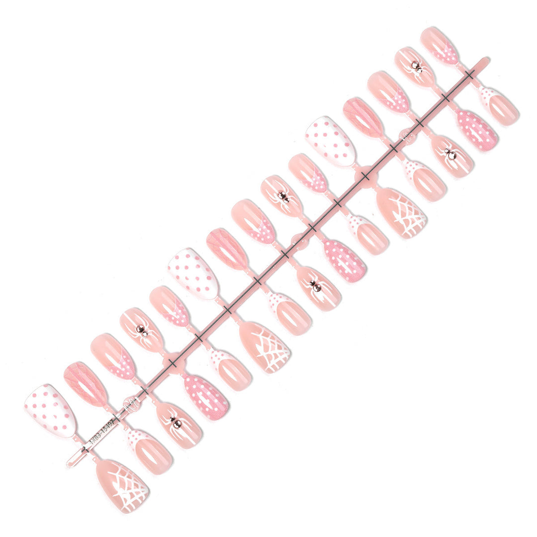 Artificial nail set with playful spider and polka dot motifs Stornfield