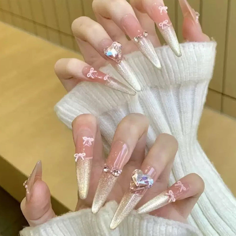Art nail set with sparkling tips and delicate bow decorations Stornfield