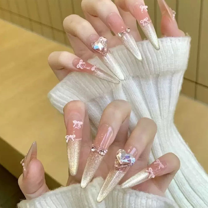 Art nail set with sparkling tips and delicate bow decorations Stornfield