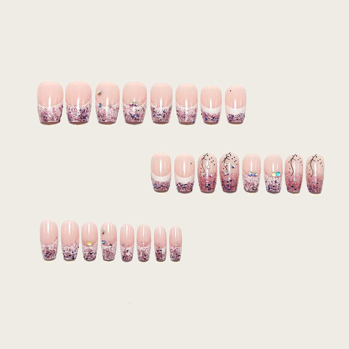 Glamorous artificial nails with glitter and rhinestone embellishments Stornfield