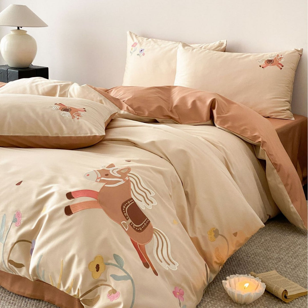 Children's satin bed linen set with embroidered rocking horse applications and velvety texture