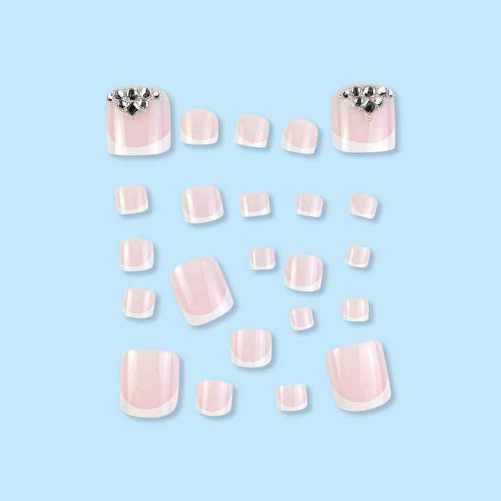 Nail art set with elegant French tips and sparkling rhinestone details Stornfield