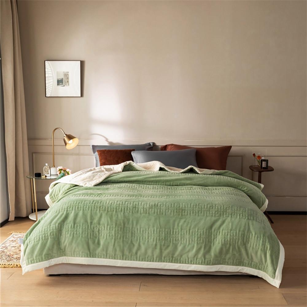Reversible quilted comforter with structured box stitching and cotton trim
