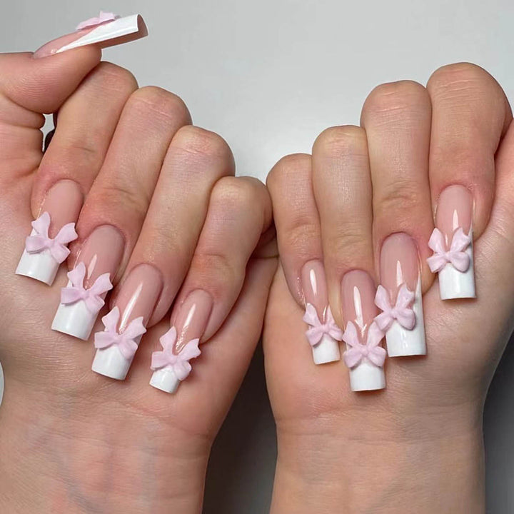 Artificial nails with playful bow design Stornfield
