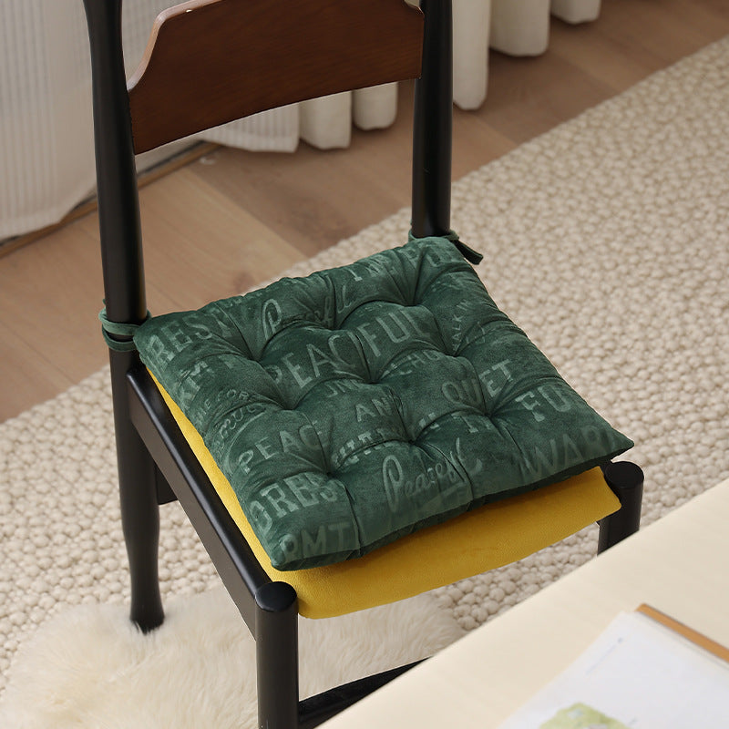 Padded square seat cushion with tufting and attachment ribbons Stornfield