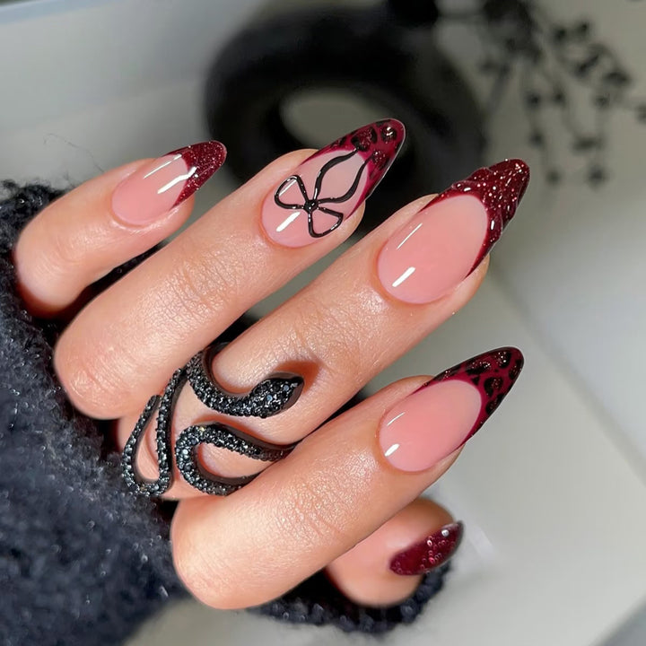 Artistic Stiletto Press-On Nails with Unique Black and Red Design Stornfield