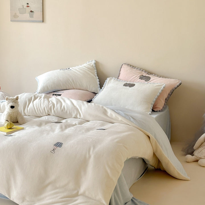 Bedding set with embroidered motif details, pompom trim and soft woven cotton finish