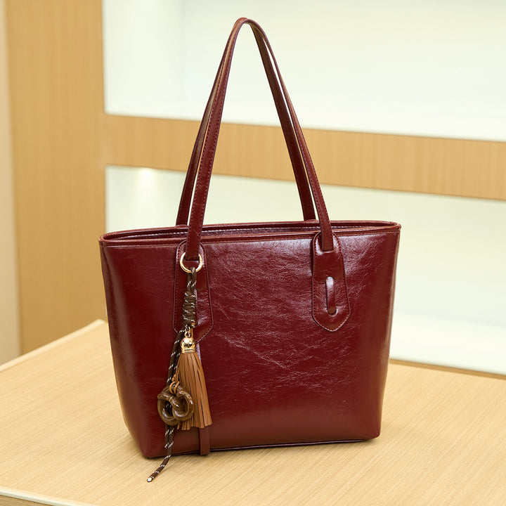 Elegant Structured Handbag with Tassel Detail