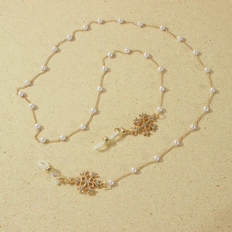 Elegant glasses holder chain with pearls and snowflake pendant Stornfield