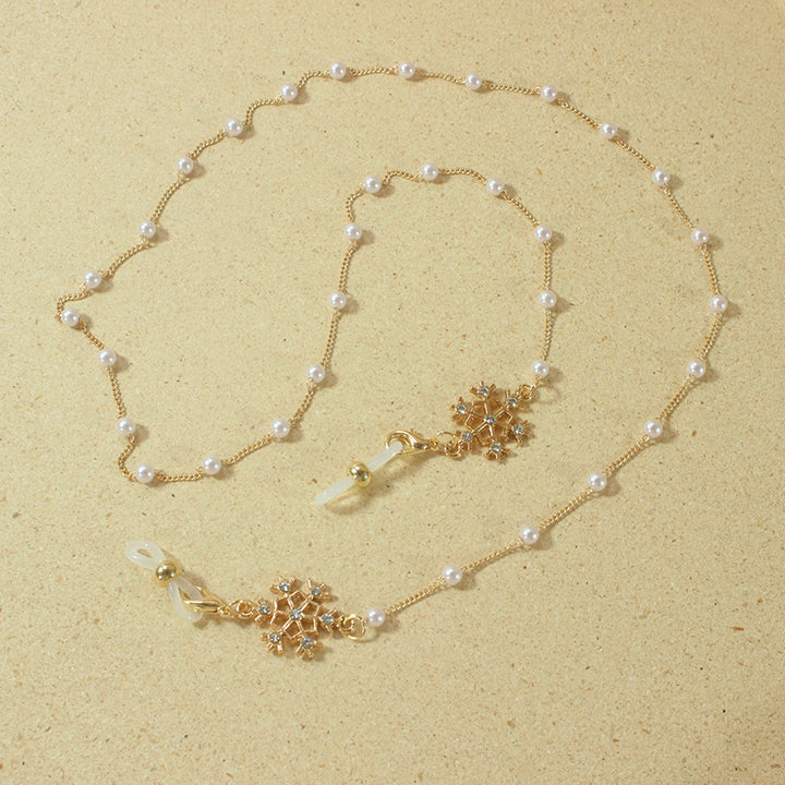 Elegant glasses holder chain with pearls and snowflake pendant Stornfield