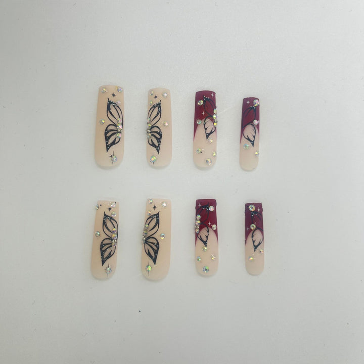 Artistic Long Nail Extensions with Butterfly Design Stornfield