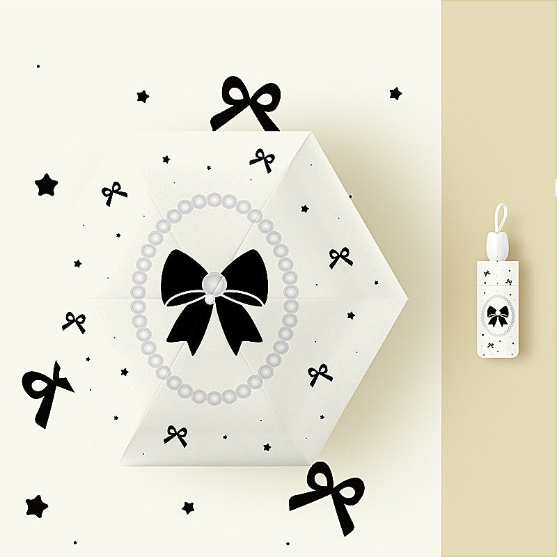 Ladies folding umbrella with playful flower design Stornfield