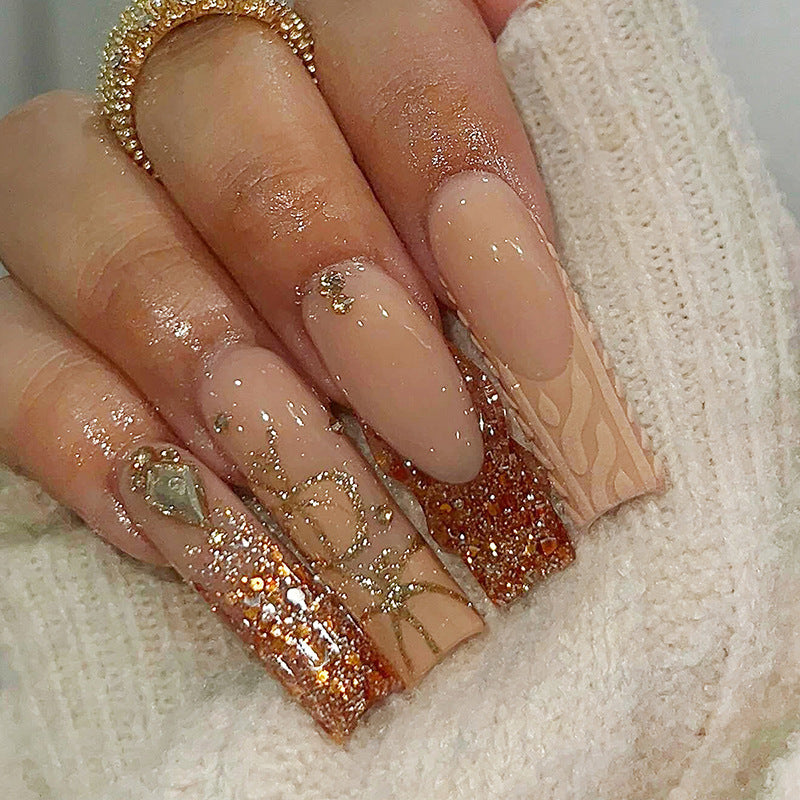 Glamorous artificial nail set with glitter and elegant embellishments Stornfield