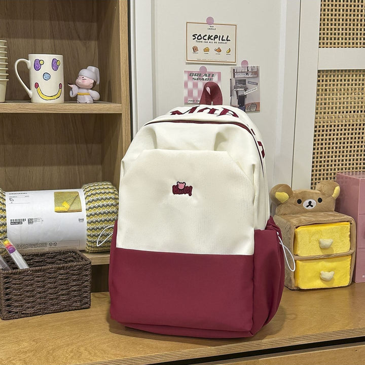 Playful backpack with embroidered Stornfield motif