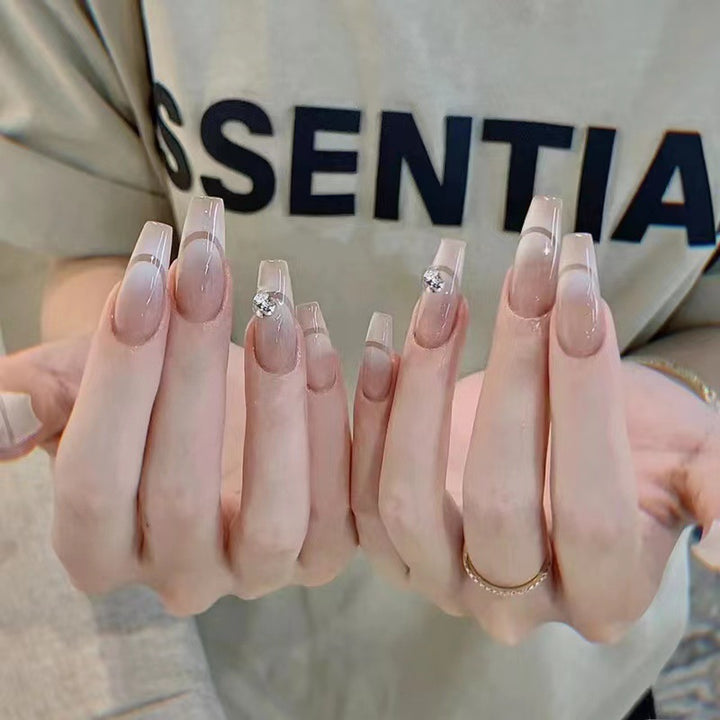 Glamorous artificial nails with elegant rhinestone decorations Stornfield