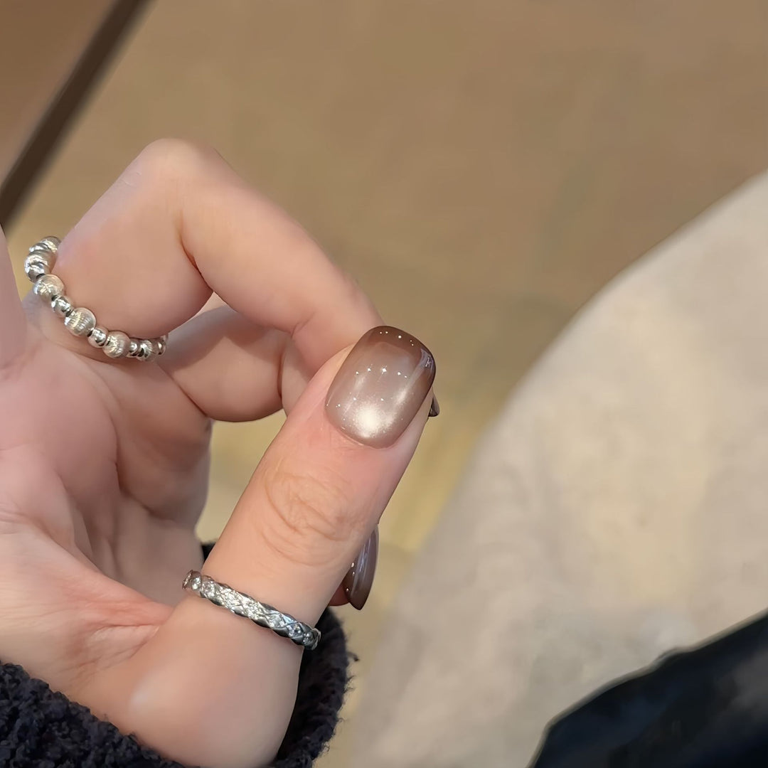 Artificial nails with elegant gradient color and glitter elements Stornfield