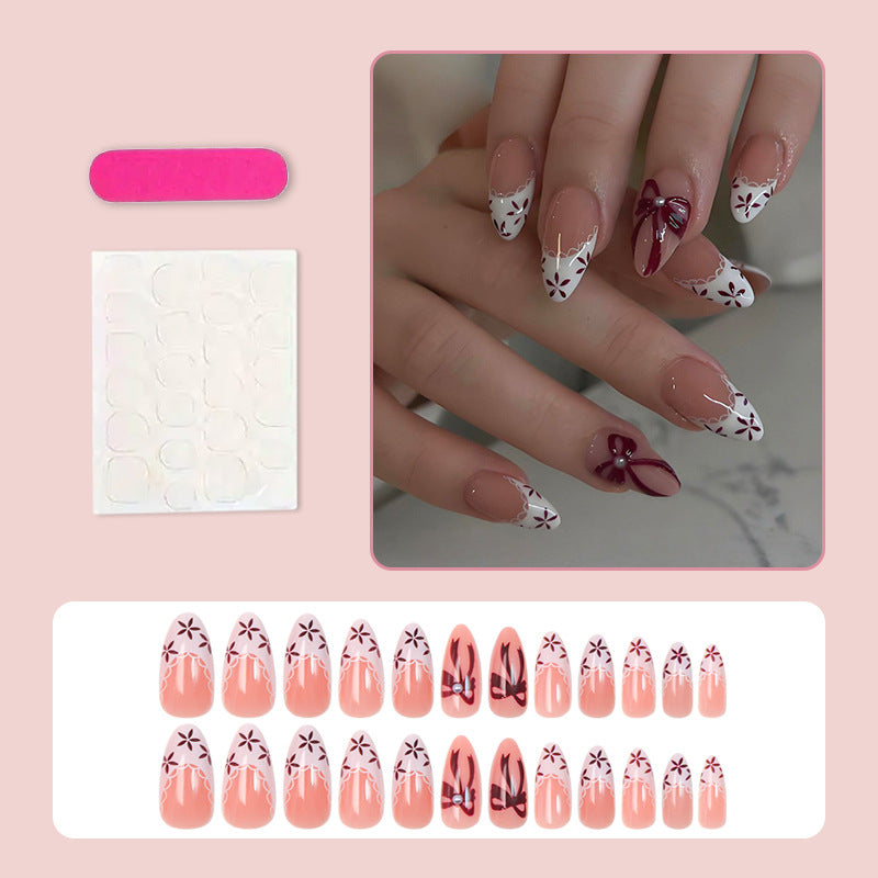 Artificial nail set with elegant bow and flower details Stornfield