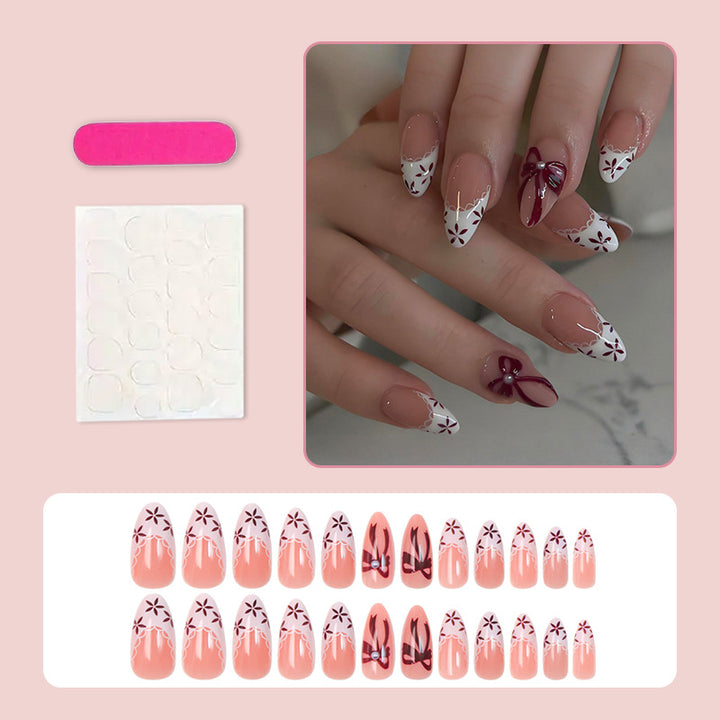 Artificial nail set with elegant bow and flower details Stornfield
