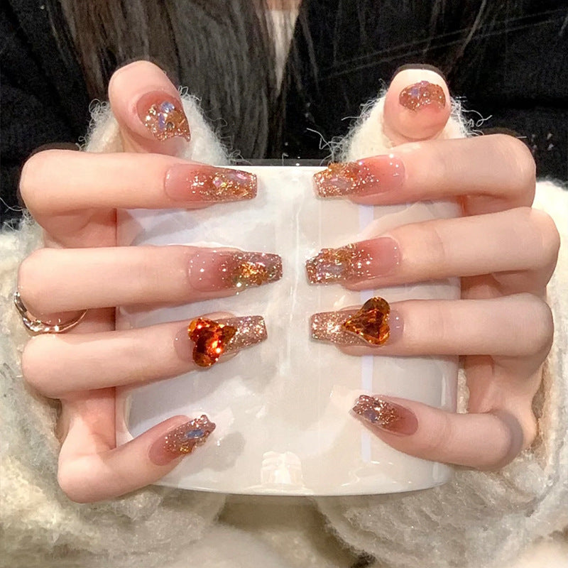 Artificial nail set with glitter and heart accents Stornfield