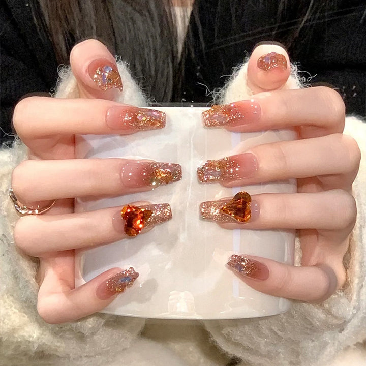 Artificial nail set with glitter and heart accents Stornfield