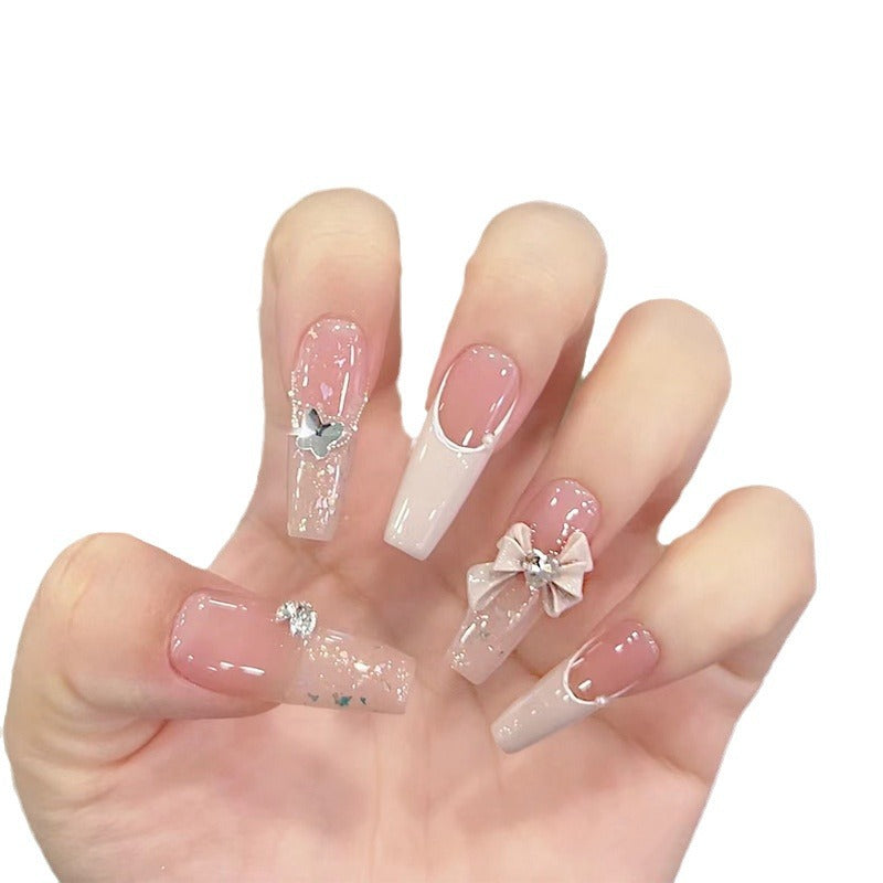 Artificial nails with glitter accents and playful motifs Stornfield