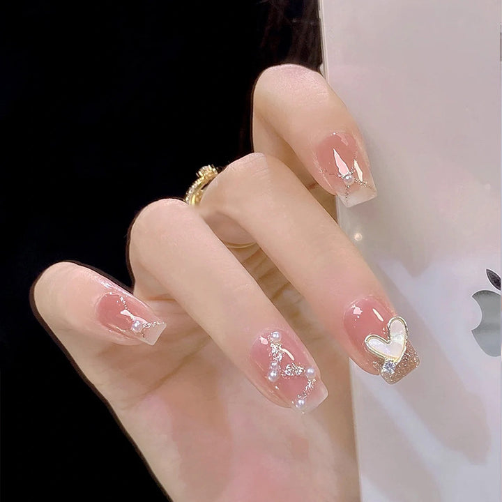 Artificial nail set with elegant pearl and glitter accents Stornfield