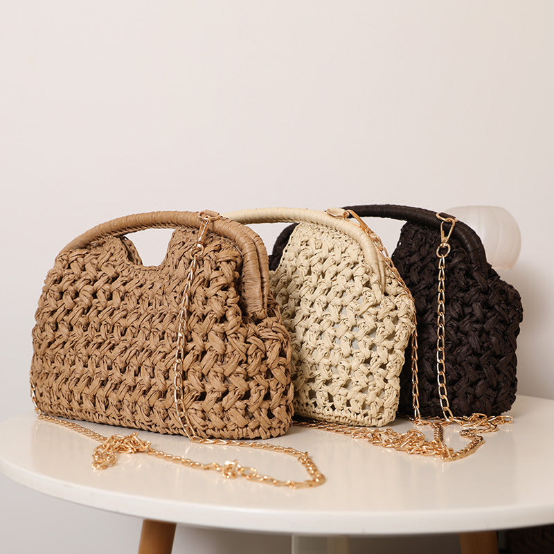 Handcrafted rattan bag with elegant handles and chain straps Stornfield
