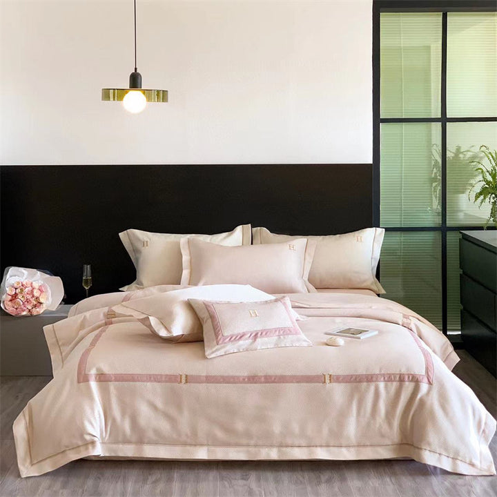 Exclusive satin bedding set with fine piping and monogram embroidery