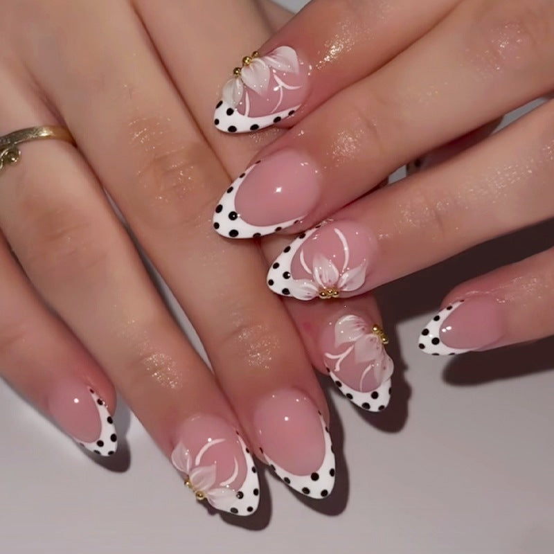 Artificial nail set with elegant flower and dot designs Stornfield