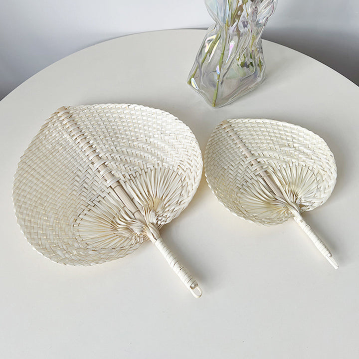 Women hand-woven fan made of natural material Stornfield