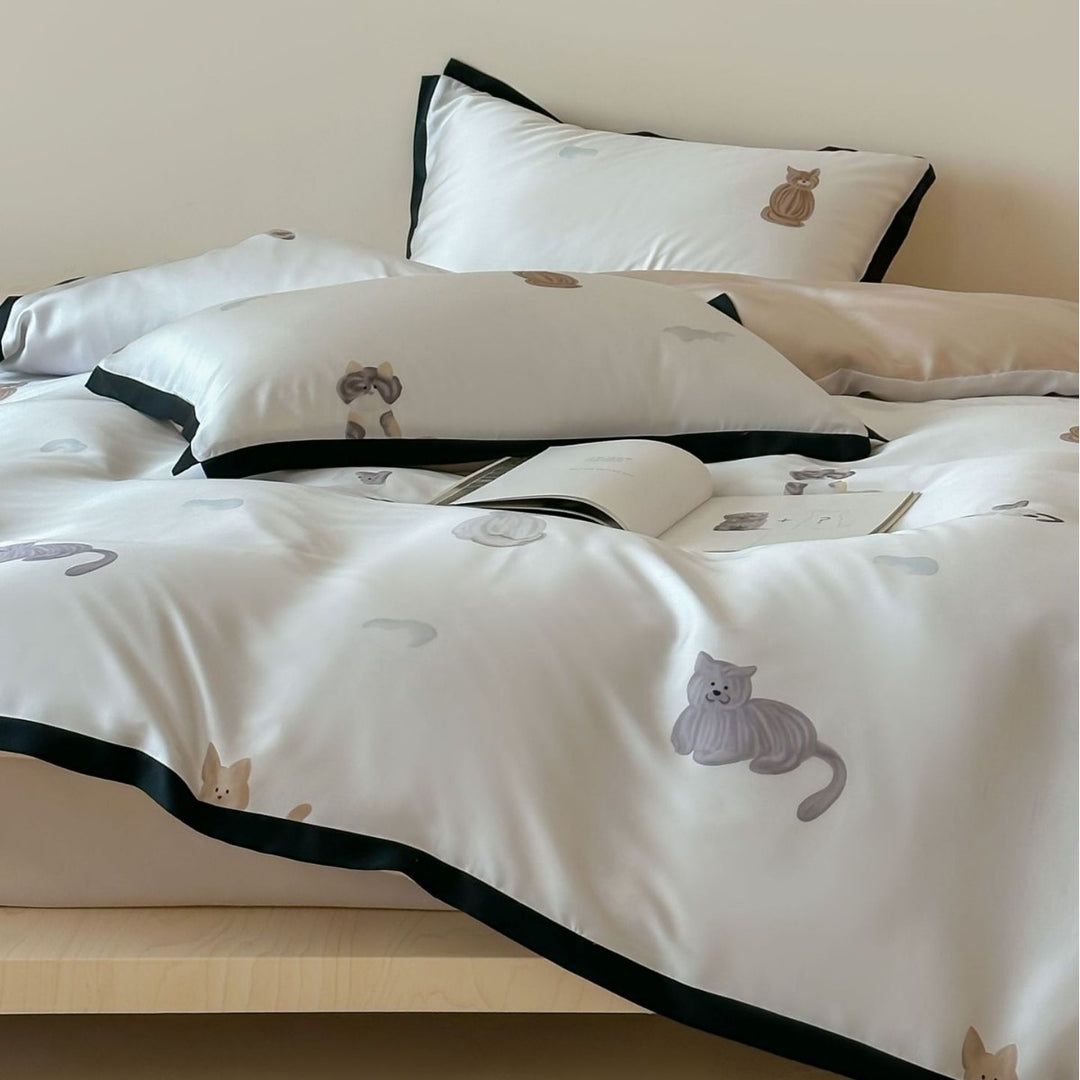 Silk-gloss satin bedding set with minimalist cat illustrations and fine piping
